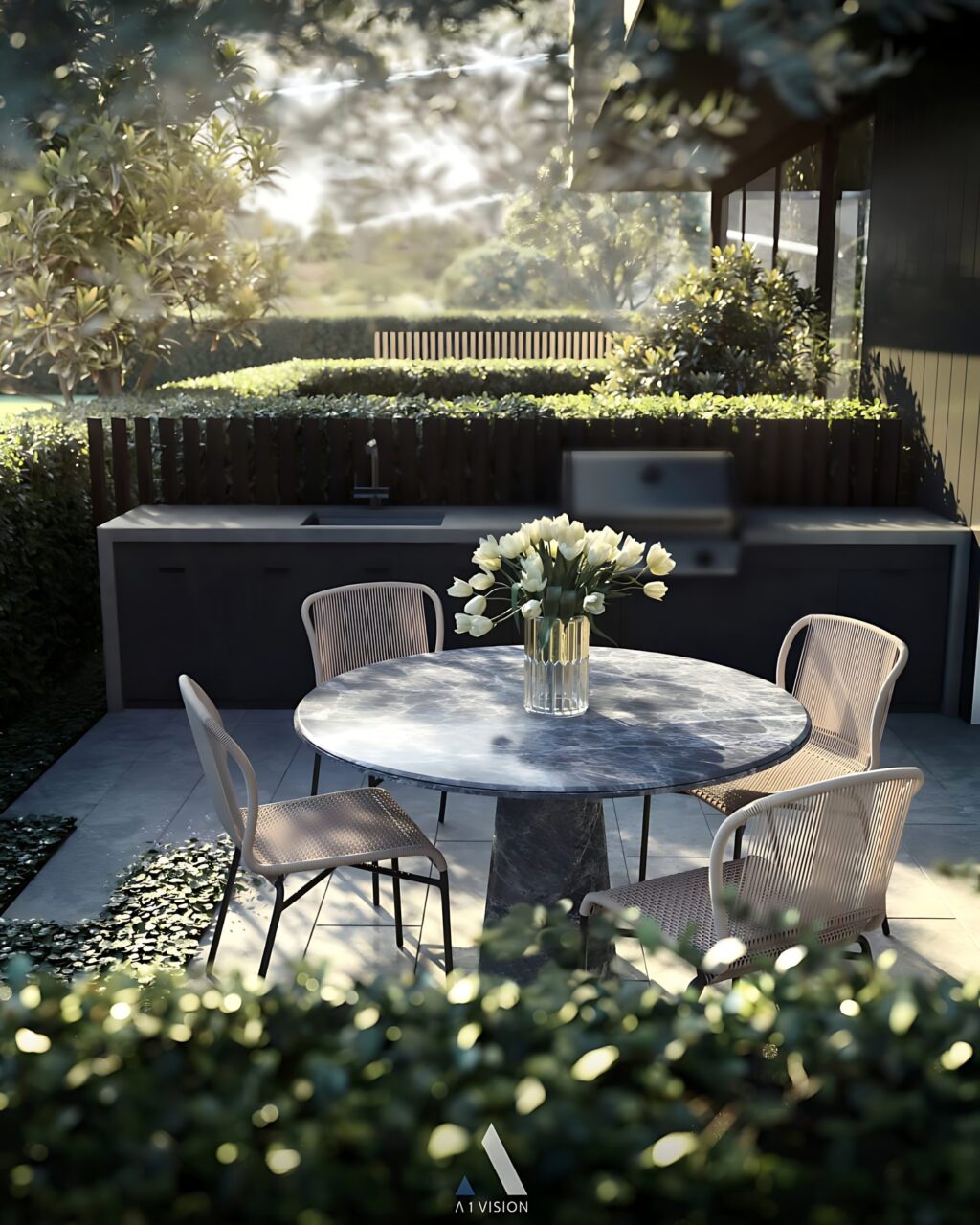 Table ronde de jardin installée sur une petite terrasse extérieure.